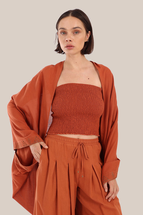 Embroidered cover up coat with short sleeves.